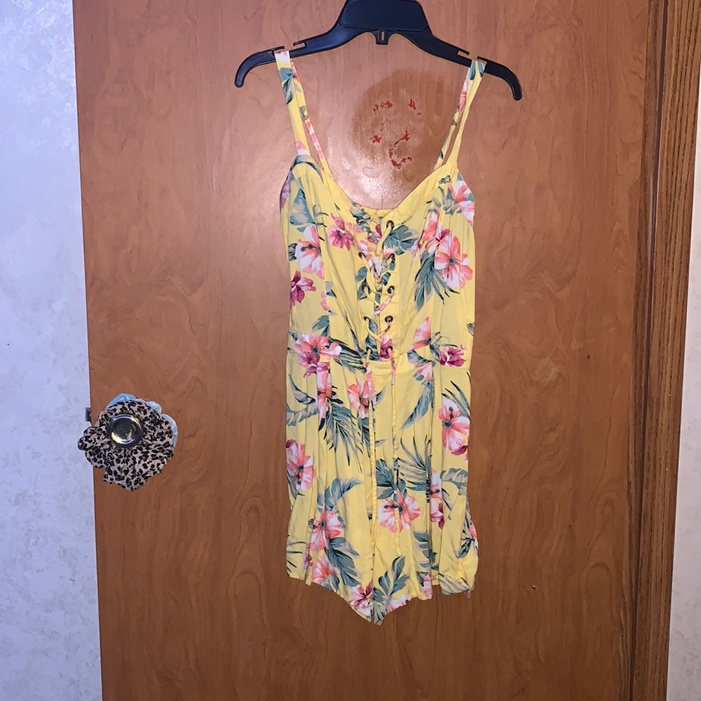 Flower Yellow Jumper or Romper.From Hollister.Girls Large.Can tighten in chest.